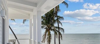 Private Beach Oceanfront Mansion in Luxurious Naples Spacious 5-bedroom Palms