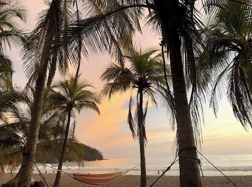 Tranquil retreat on coastal route. By sand, surf, river, & jungle. Perfect vibe.