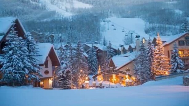 A snow-covered mountain resort with a ski lift, wooden buildings, and a lit sign indicating a restaurant. - Beaver Creek Resort CO - Townsend Place & Strawberry Park Condos (Avon)