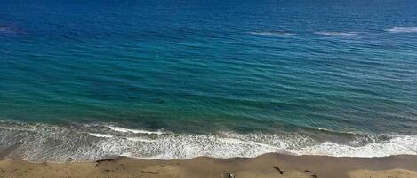On the beach, sun-loungers, beach towels