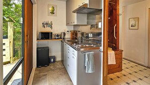 Microwave, electric kettle, cookware/dishes/utensils, spices