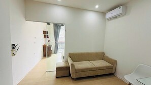 Appartamento Deluxe, balcone, vista città | Area soggiorno