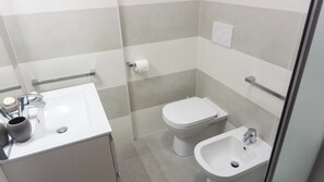 Hair dryer, bidet, towels, soap