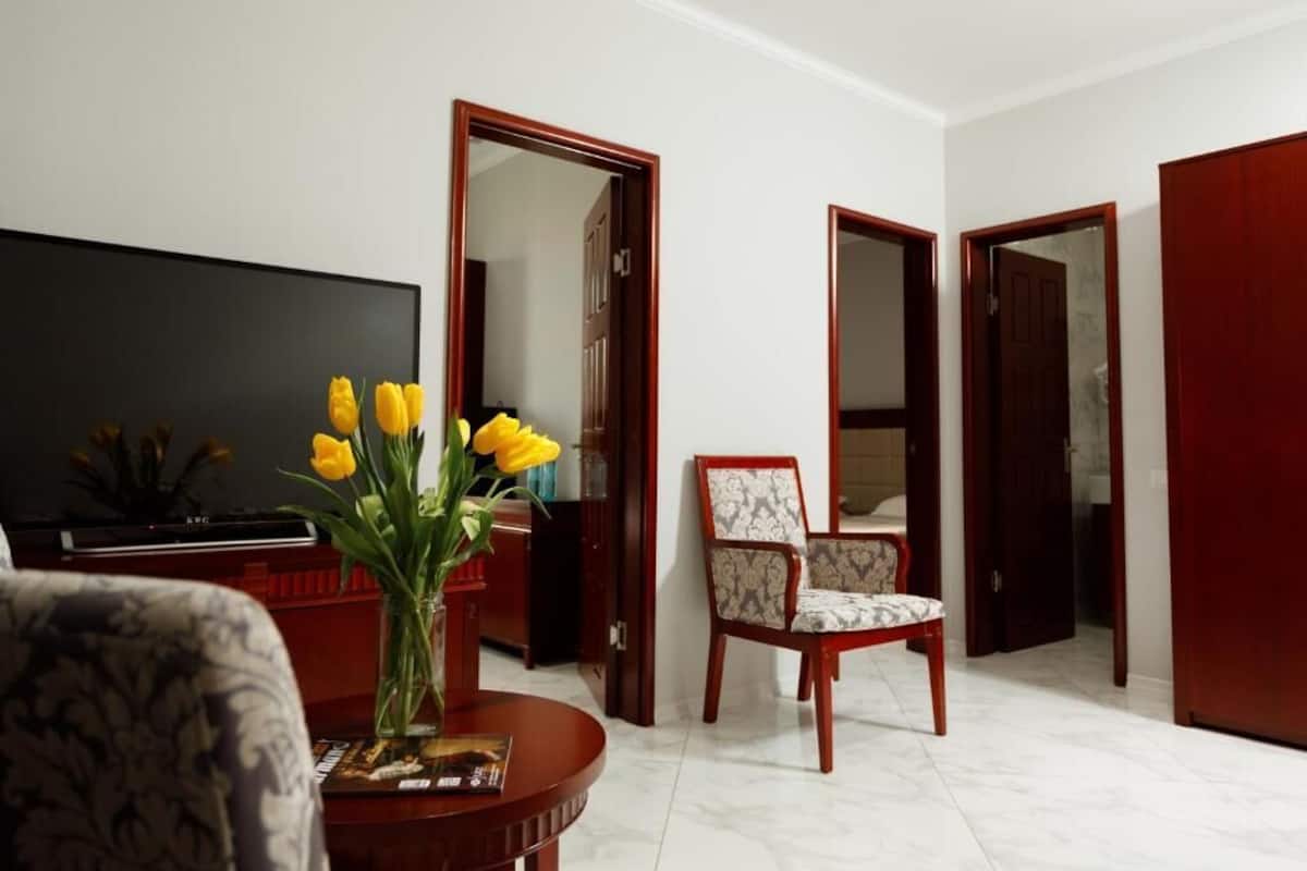 Luxury Suite, Balcony, Pool View | 1 bedroom, in-room safe, desk, laptop workspace