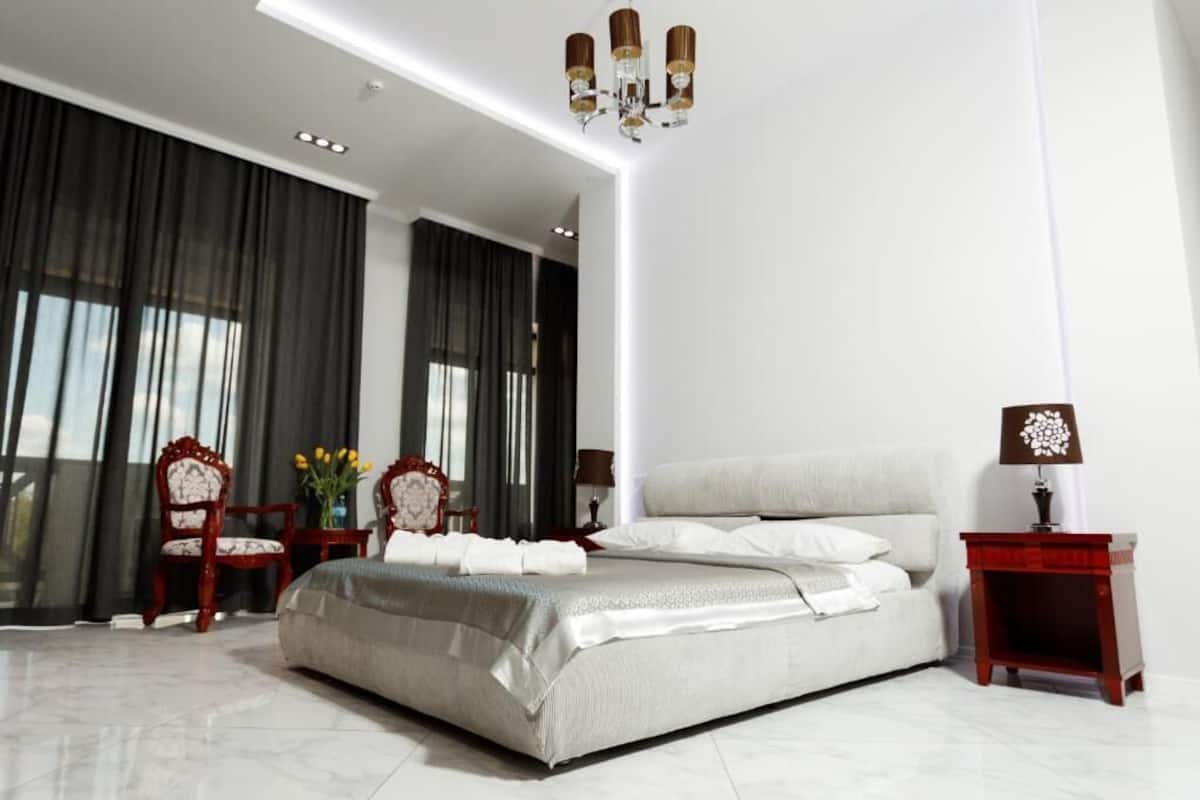 Deluxe Double Room Single Use, Balcony | 1 bedroom, in-room safe, desk, laptop workspace