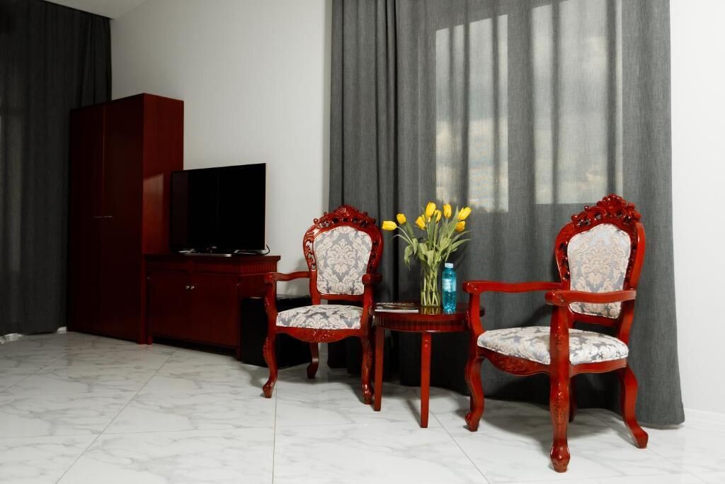 Luxury Suite, Balcony | In-room safe, desk, laptop workspace, blackout drapes