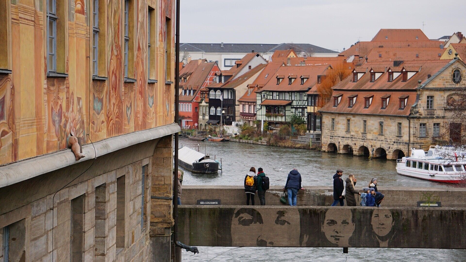 A river with buildings and a boat.