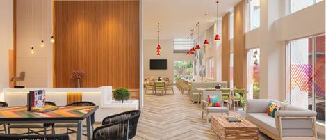 Un hall d’hôtel spacieux, doté d’un sol à motifs en chevrons, d’un espace salon central avec un canapé et des fauteuils, et d’un coin repas avec une table et des chaises.