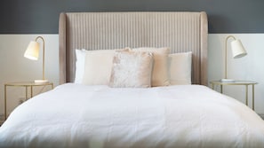 Restful retreat with a large bed, bedside tables, and a neutral color scheme.