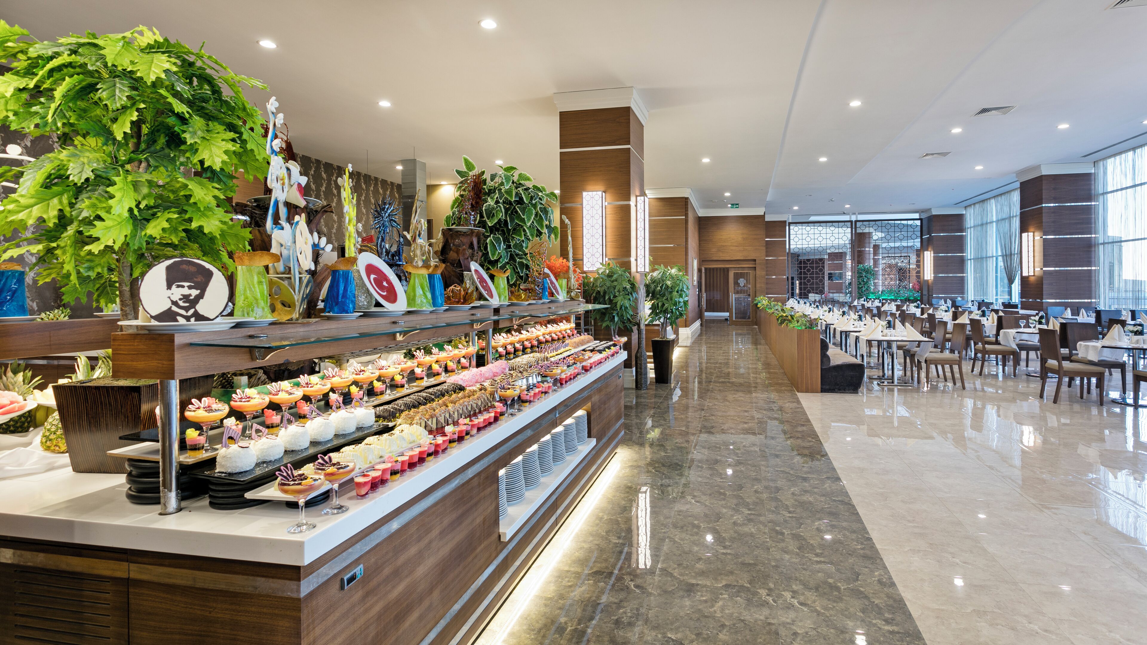 A buffet with a variety of food items and a long counter.