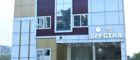 A modern building with a sign reading "SPECTRA".