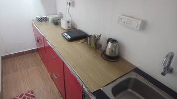 Studio Deluxe, quang cảnh sân vườn | Bếp nhỏ riêng