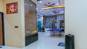A spacious room with a high ceiling, recessed lighting, and ceiling fans. - GoBravo 11 6BHK Farm with Pool Sohna Road Gurgaon  (Sohna)