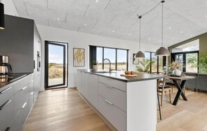 Fridge, stovetop, dishwasher, coffee/tea maker