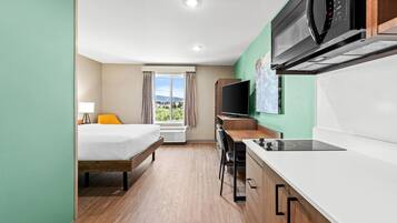 Suite, 1 Queen Bed, Non Smoking | Desk, laptop workspace, free WiFi, bed sheets