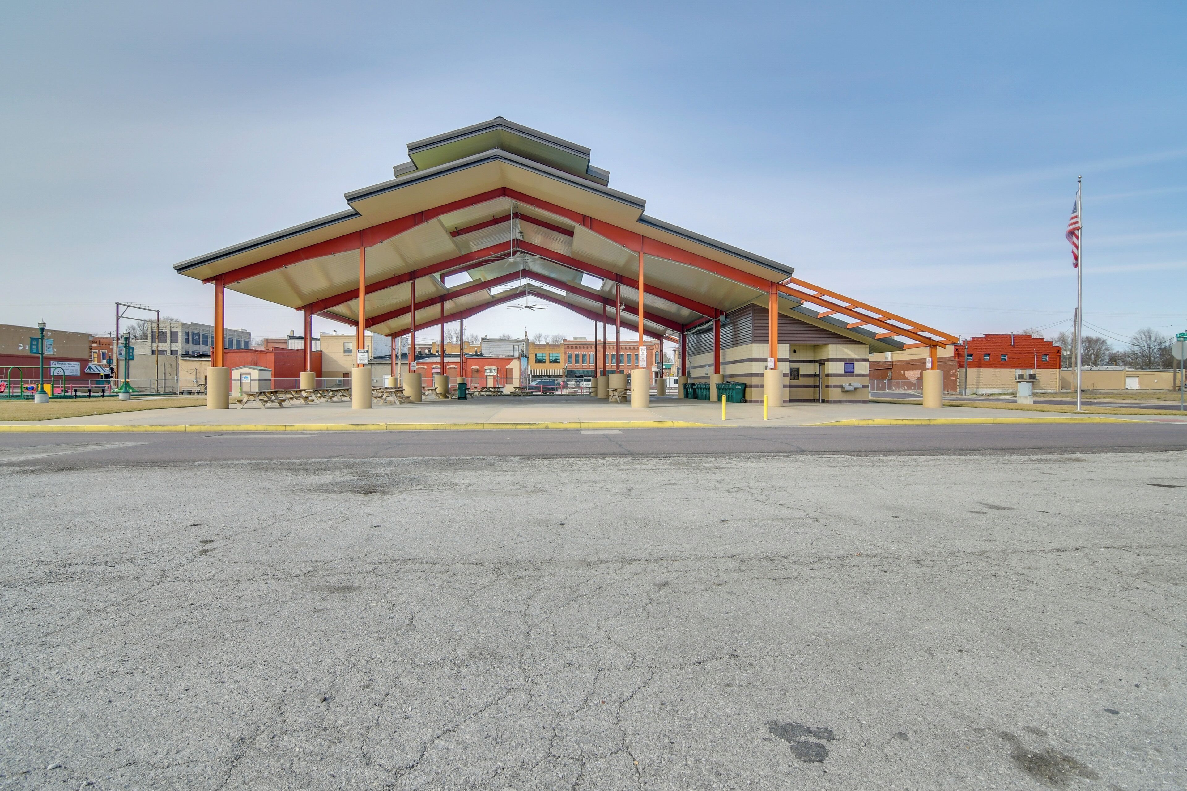 A gas station with a large canopy and multiple fuel pumps.