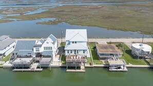 A waterfront property with multiple buildings, docks, and a large body of water.