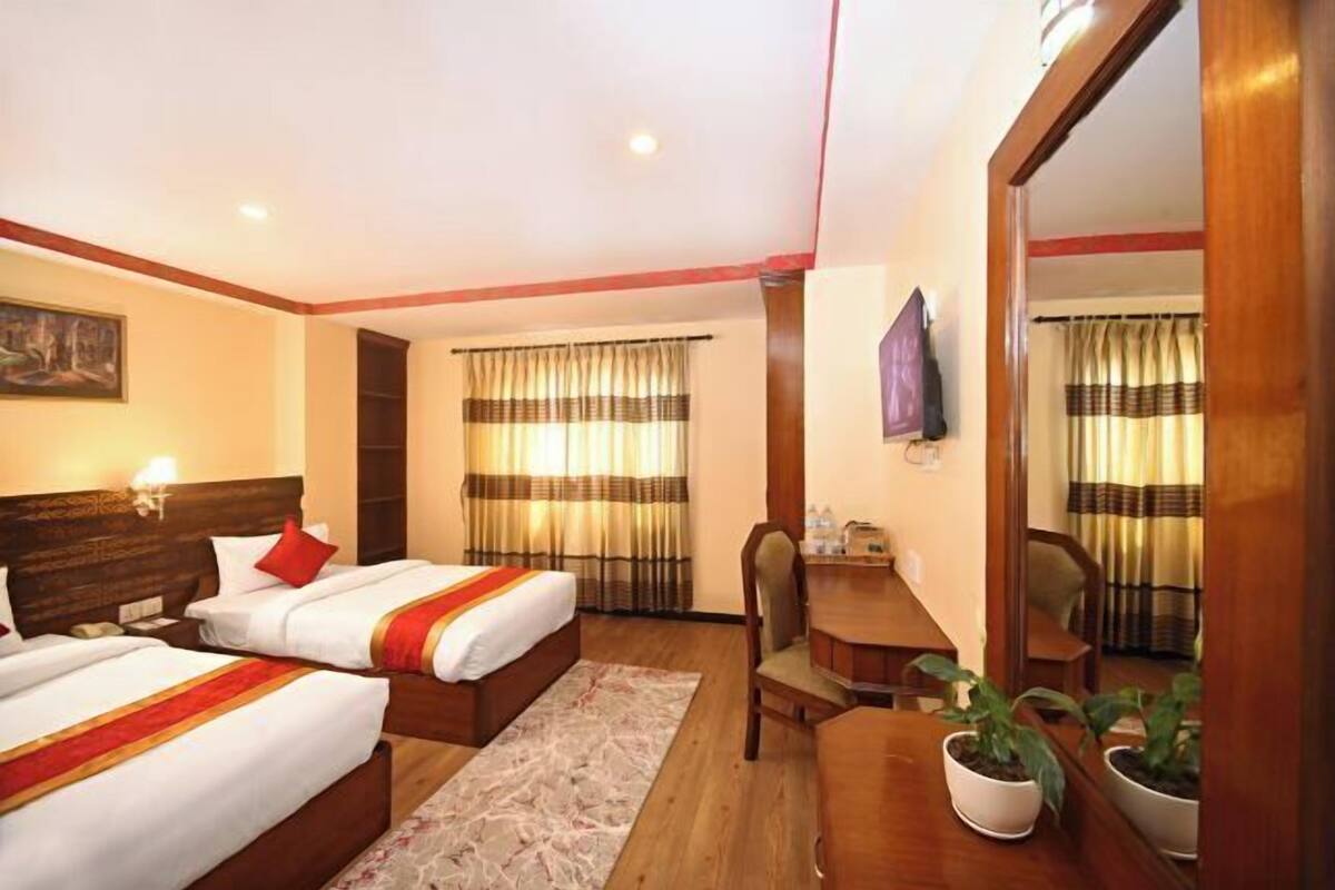 1 dormitori, escriptori i espai de treball apte per a portàtils