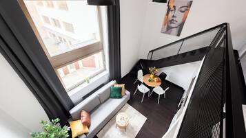 Classic Apartment, Balcony, City View | Living area | 50-inch LED TV with cable channels