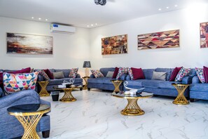 Elite Villa, 2 Bedrooms, Pool View | Living area | 74-inch Smart TV with digital channels, fireplace, MP3 dock