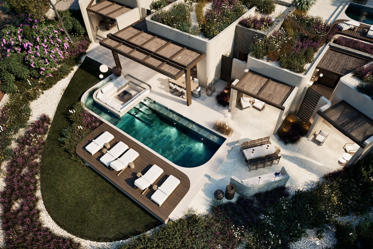 An aerial view of a modern resort with a swimming pool, sun loungers, and outdoor seating areas.