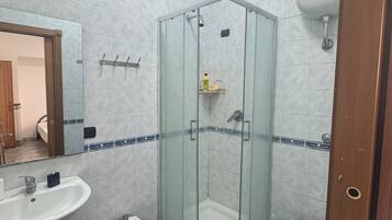 Combined shower/tub, soap, toilet paper