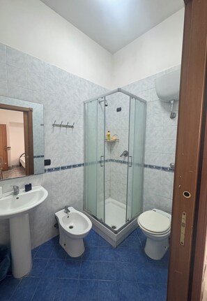 Combined shower/bathtub, soap, toilet paper