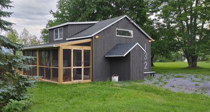 Charming cottage with a mountain view from the wrap-around deck.