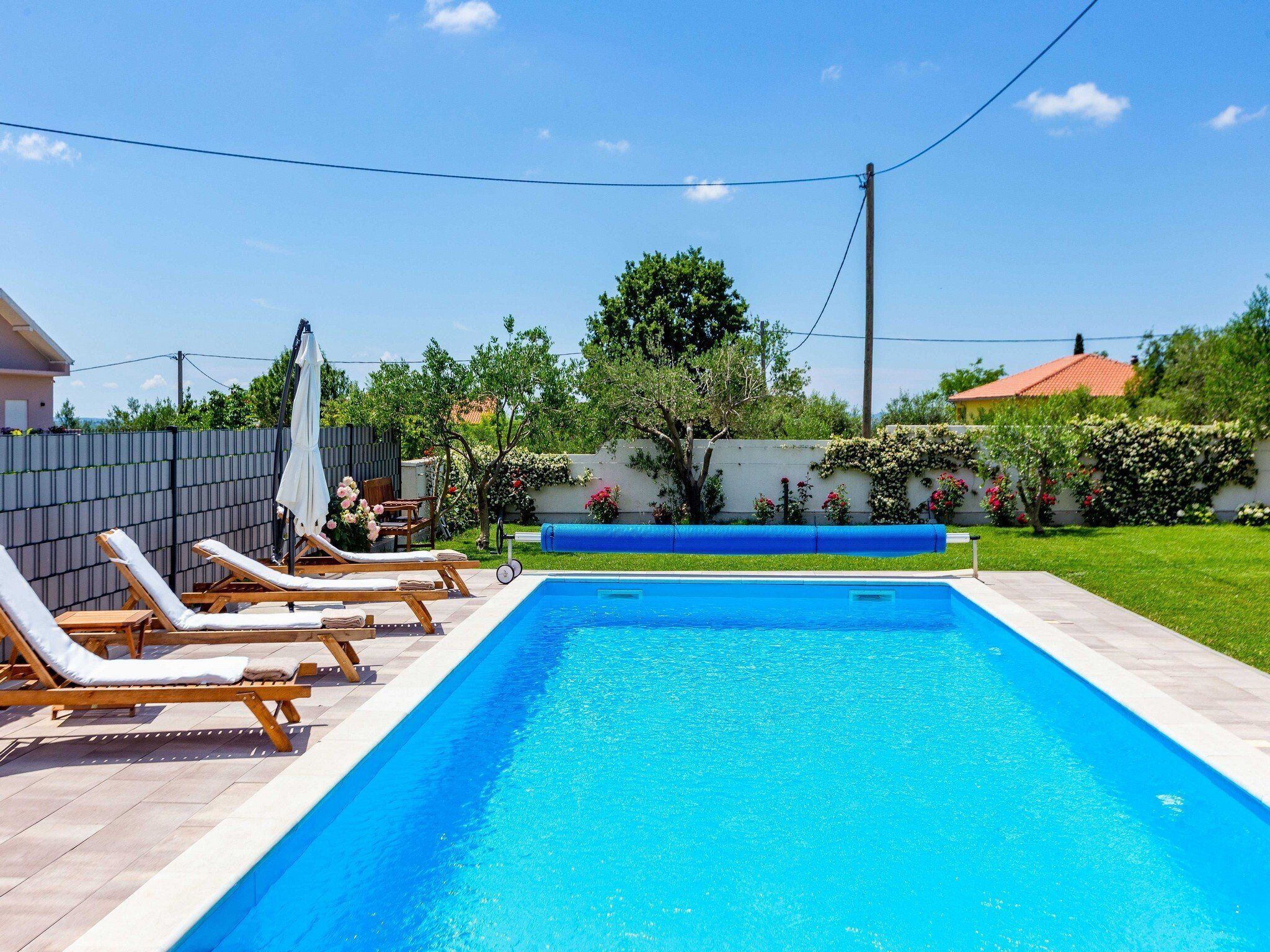 House (Two Bedroom Holiday Home) | Pool | Seasonal outdoor pool, pool umbrellas, sun loungers