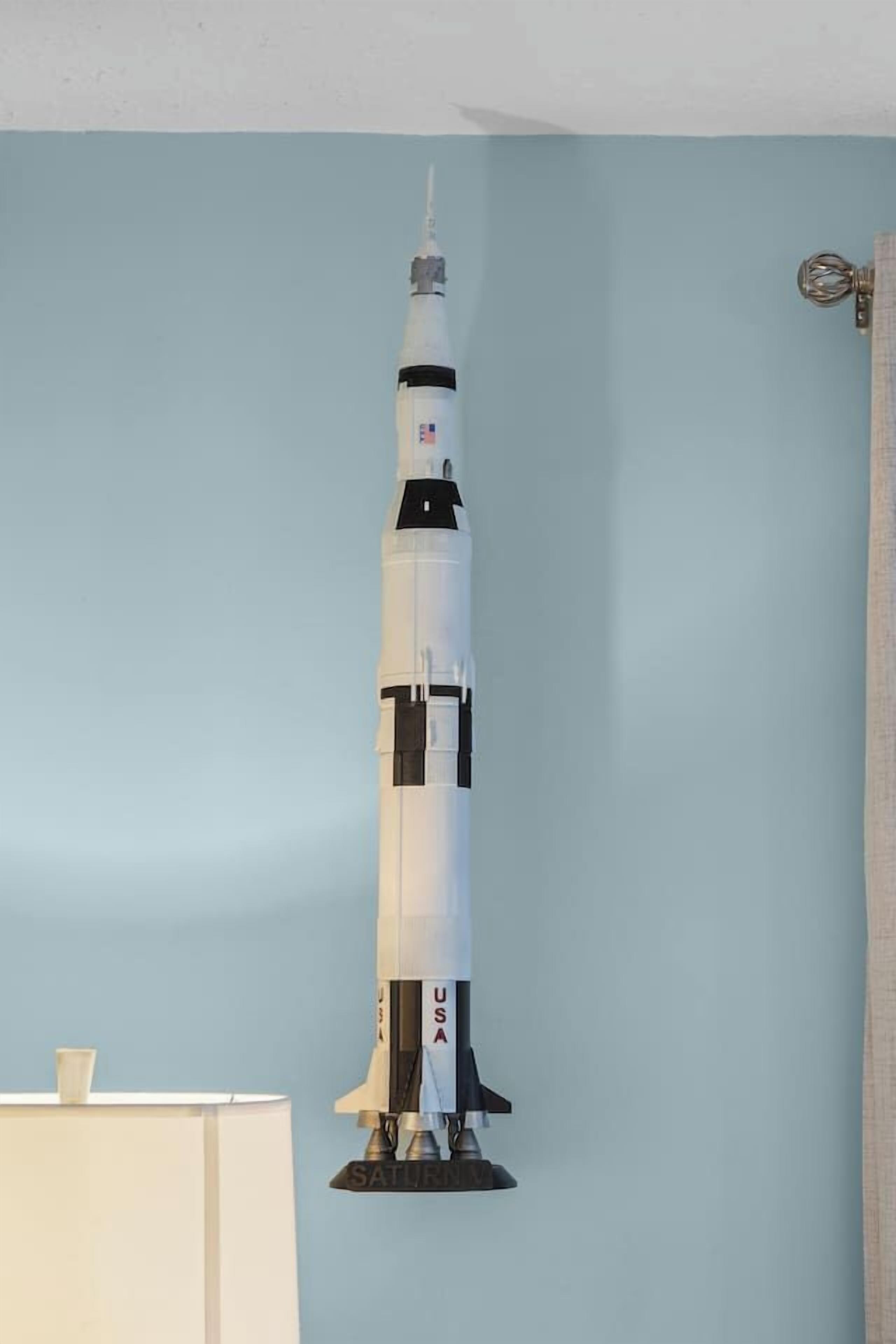 A model of a space shuttle mounted on a wall.
