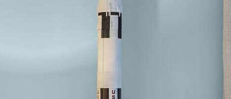 A model of a space shuttle mounted on a wall.