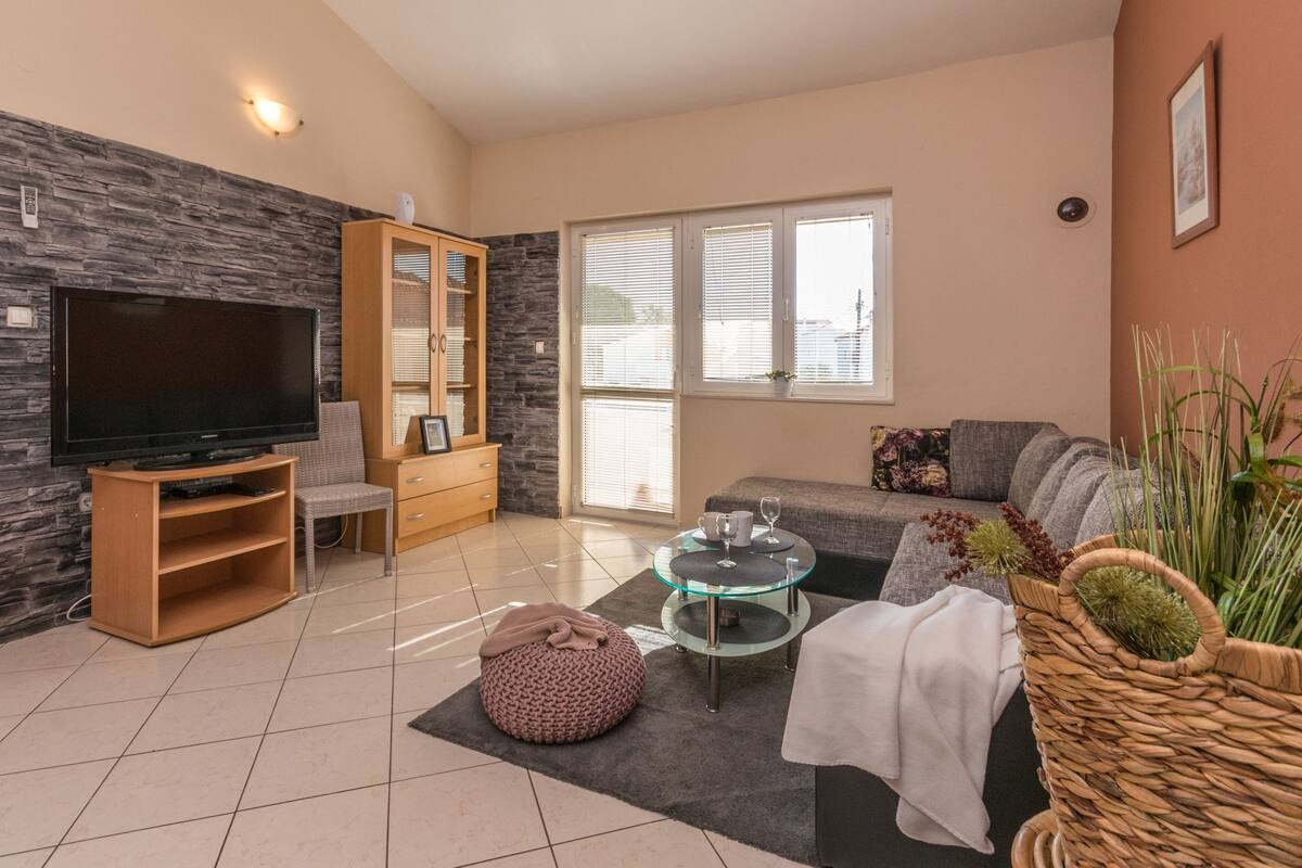 Apartment (One Bedroom Apartment 2) | Living room | 32-inch flat-screen TV with satellite channels