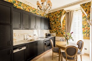 Oven, dishwasher, toaster, dining tables