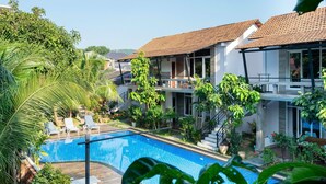 A modern two-story house with a swimming pool, surrounded by lush greenery and palm trees. - Lan Anh Garden Resort (Phu Quoc)