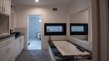 Jetted tub, hair dryer, towels, soap