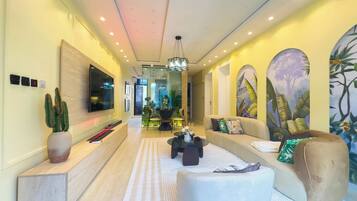 Exclusive Apartment, 2 Bedrooms, Non Smoking, Balcony | Living area | 50-inch Smart TV with cable channels, video-game console, MP3 dock