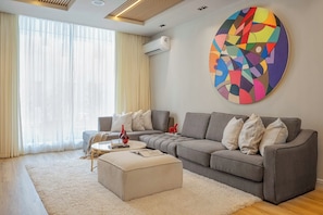 Classic Apartment, 2 Bedrooms, Non Smoking, Balcony | Living area | 50-inch Smart TV with cable channels, video-game console, MP3 dock - Libertini Apartments by Ken-Legend (Lekki)