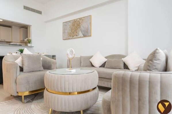 Luxury Apartment, City View | Living area | 65-inch Smart TV with cable channels