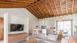 A modern living space with a TV, wooden furniture, a kitchen, and a dining area. - RURAL HOUSE CERCADO DE DON PACO (Santa Lucia De Tirajana (Capital Municipal))