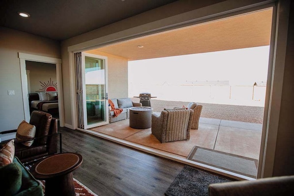A modern living room with a sofa, chairs, and a coffee table.