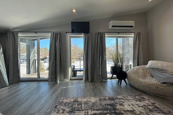 Sliding glass doors lead to the balcony