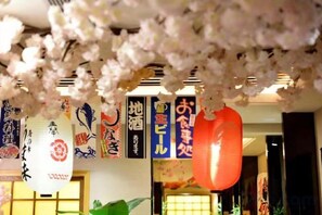 A traditional Japanese interior with hanging decorations and calligraphy. - Huace American Hotel (Shenzhen Longgang Shuanglong Subway Station) (Shenzhen)