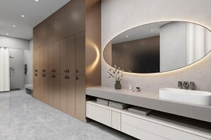 A modern bathroom with a large mirror, wooden cabinets, and a marble floor. - Huace American Hotel (Shenzhen Longgang Shuanglong Subway Station) (Shenzhen)