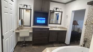 Jetted tub, hair dryer, towels, soap