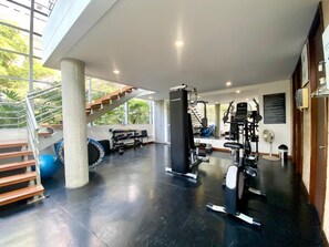Stay active in our well-equipped gym with a range of exercise equipment, including a stationary bike, rowing machine, and free weights.