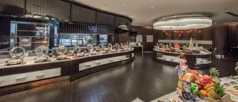 A buffet area with multiple food stations and a variety of dishes.