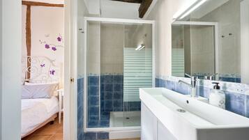 Superior Studio, Courtyard View | Bathroom | Hair dryer, towels, soap, toilet paper