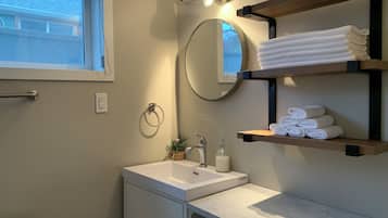 Shower, hair dryer, towels, soap