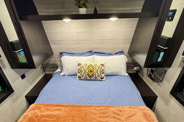 Queen walk around bed with storage cabinets on each side