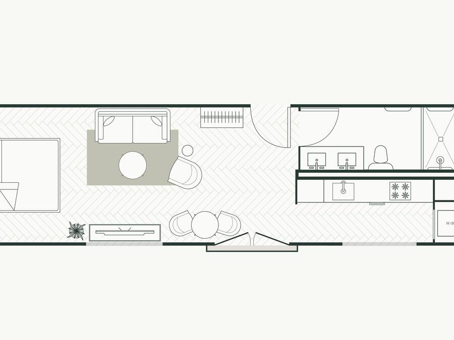 A floor plan of a hotel room with a bed, a desk, a chair, a small table, and a window.